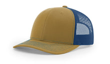 Richardson 112 Trucker Hat in Biscuit and True Blue with structured front, mesh back, pre-curved visor, and adjustable snapback closure.
