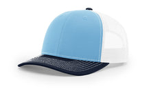 Richardson 112 Trucker Hat in Cowhide/Navy/White Tri-Color with structured front, mesh back, pre-curved visor, and adjustable snapback closure.