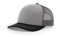 Richardson 112 Trucker Hat in Grey, Charcoal, and Black tri-color with structured front, mesh back, and adjustable snapback closure.