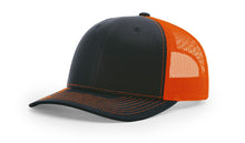 Richardson 112 Trucker Hat in Navy and Neon Orange with structured front, mesh back, pre-curved visor, and adjustable snapback closure.