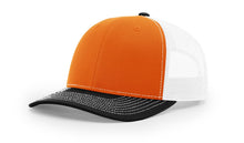 Richardson 112 Trucker Hat in Orange, White, and Black Tri-Color with structured front, mesh back, and adjustable snapback closure.