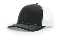 Richardson 112 Trucker Hat in Black and White with structured front, mesh back, pre-curved visor, and adjustable snapback closure.