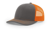 Richardson 112 trucker hat in charcoal and orange, offering a bold color contrast—ideal for custom embroidery and a standout look.