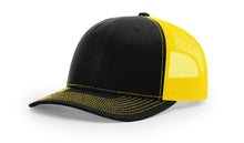 Richardson 112 trucker hat in split black and yellow with adjustable back—bold style ideal for custom embroidery or branding.