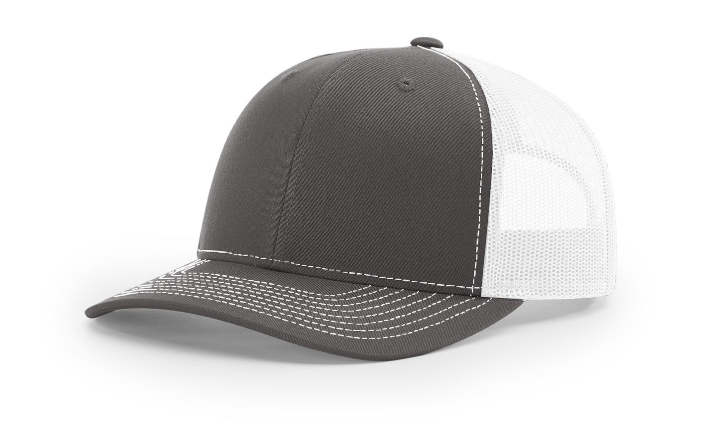 Richardson 112 Trucker Hat in Chocolate and White with structured front, mesh back, pre-curved visor, and adjustable snapback closure.
